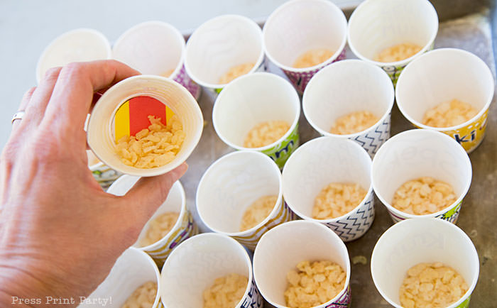 Amazing race challenge ideas - cups with rice krispies and flag at bottom - Press Print Party!
