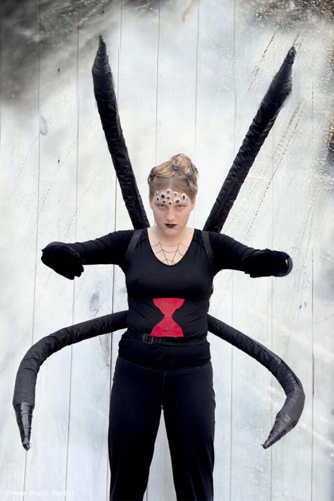 Spectacular Black Widow costume DIY - Girl standing looking like a spider.How to make a spider costume at home - Press Print Party