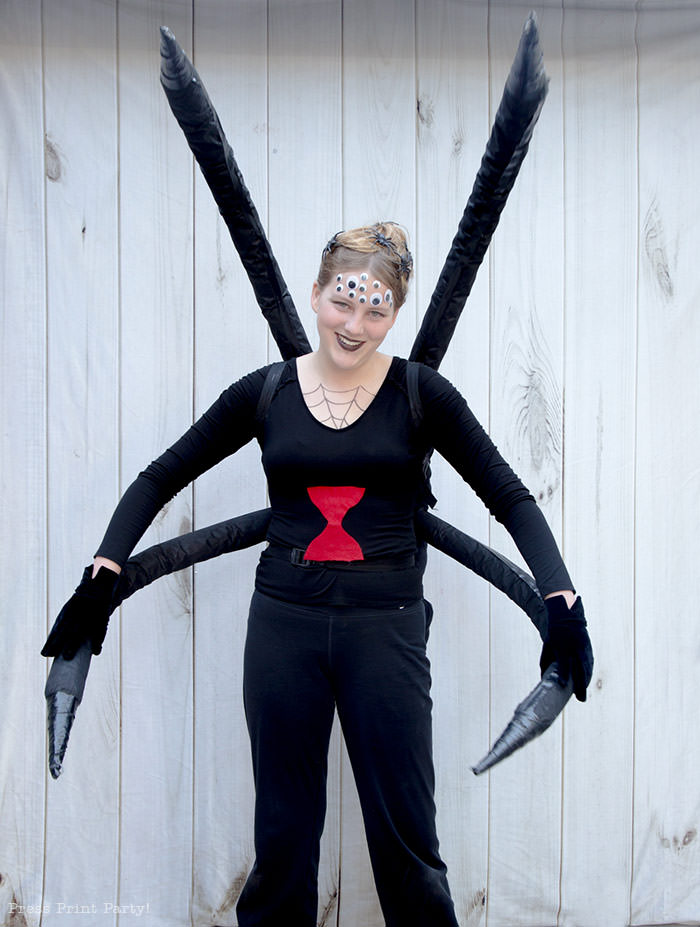 Spectacular Black Widow costume DIY - Girl standing looking like a spider.How to make a spider costume at home - Press Print Party