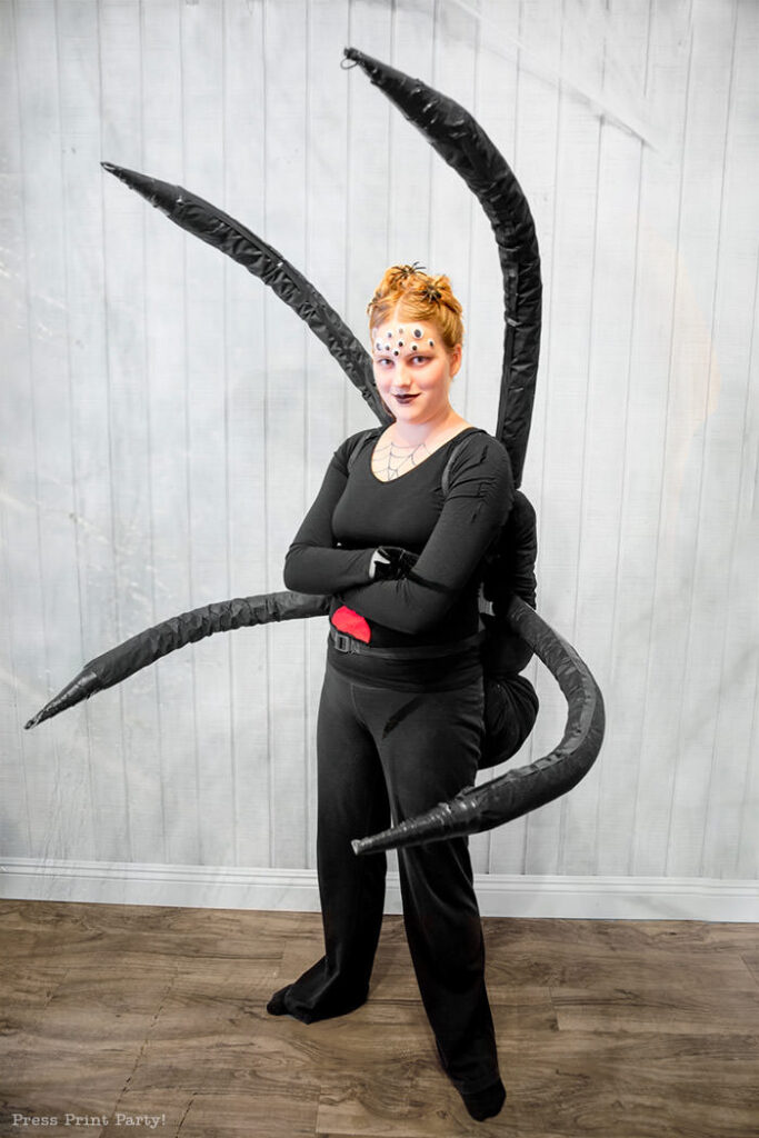 Spectacular Black Widow costume DIY - Girl standing looking like a spider.How to make a spider costume at home - Press Print Party