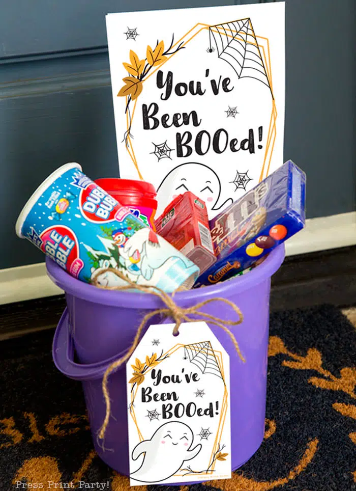 You've been booed sign and We've been booed sign halloween game with instructions Press Print Party! basket of treats at front door in bucket.