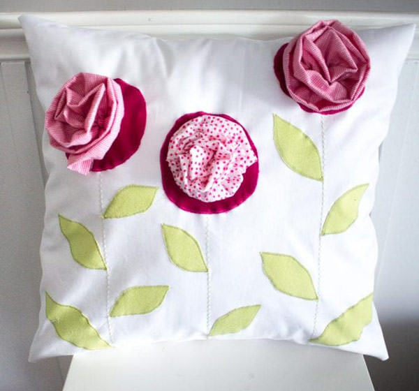 cute pillow with pink flowers made with kid's clothes. gift for mom