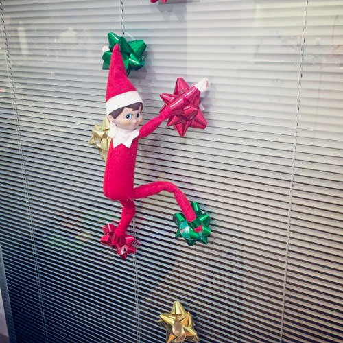 elf on the shelf climbing on bows funny idea