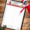 A festive “Elf Planner” sheet, designed as an elf on the shelf printable, rests on a clipboard with dates, ideas, and materials columns, lying on a wooden surface with a candy cane and a smiling elf doll in the top right corner.