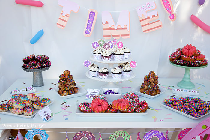 Donut party dessert bar table with all our favorite donuts - Press Print Party