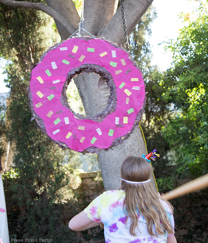 homemade donut pinata with cardboard for donut birthday party - Press Print Party