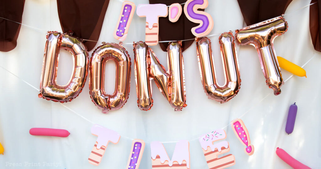 donut party ideas birthday party theme. it's donut time banner with letter balloons and donut letters. Press print Party!