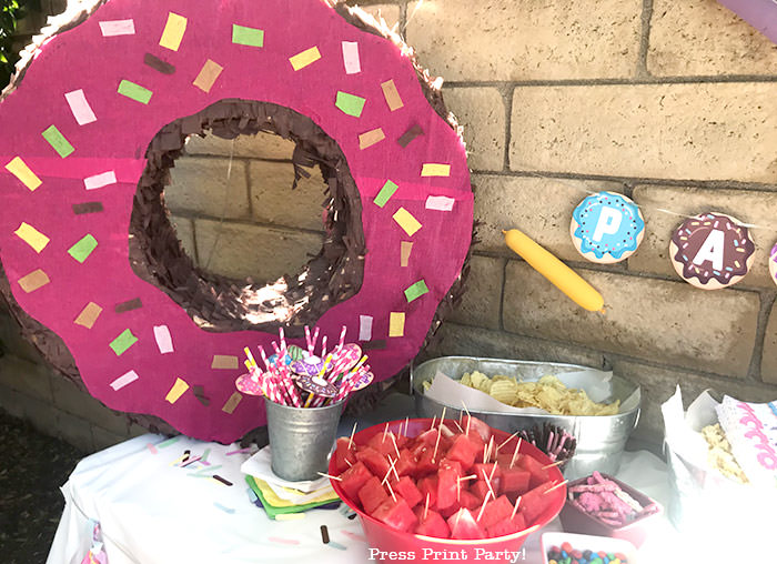 homemade donut pinata on snack table. Press Print Party