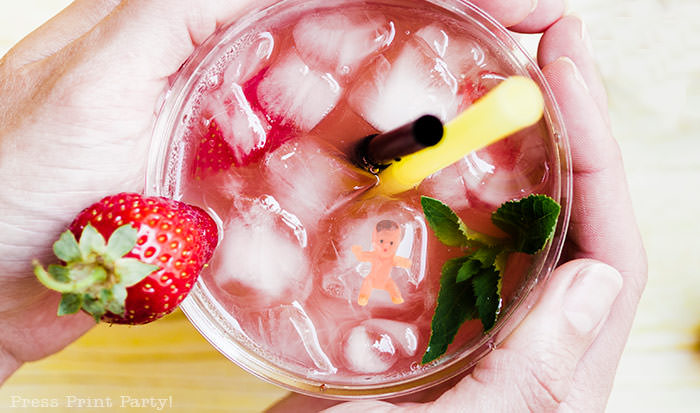 baby ice cubes baby shower game ice breaker. strawberry drink with plastic baby in ice cude poking out. Press Print Party!