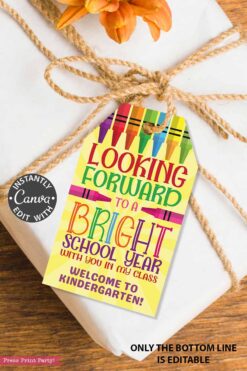 A white gift wrapped with brown twine and an orange flower features a colorful