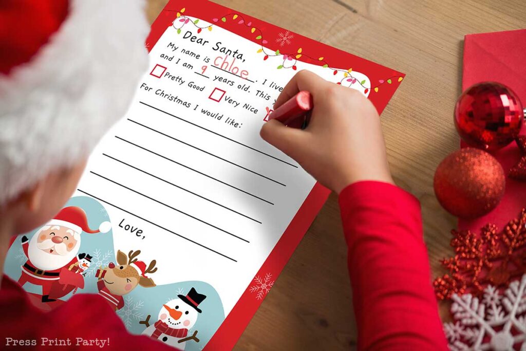 girl writing a letter to santa. free printable santa letter template for kids. Press Print Party.