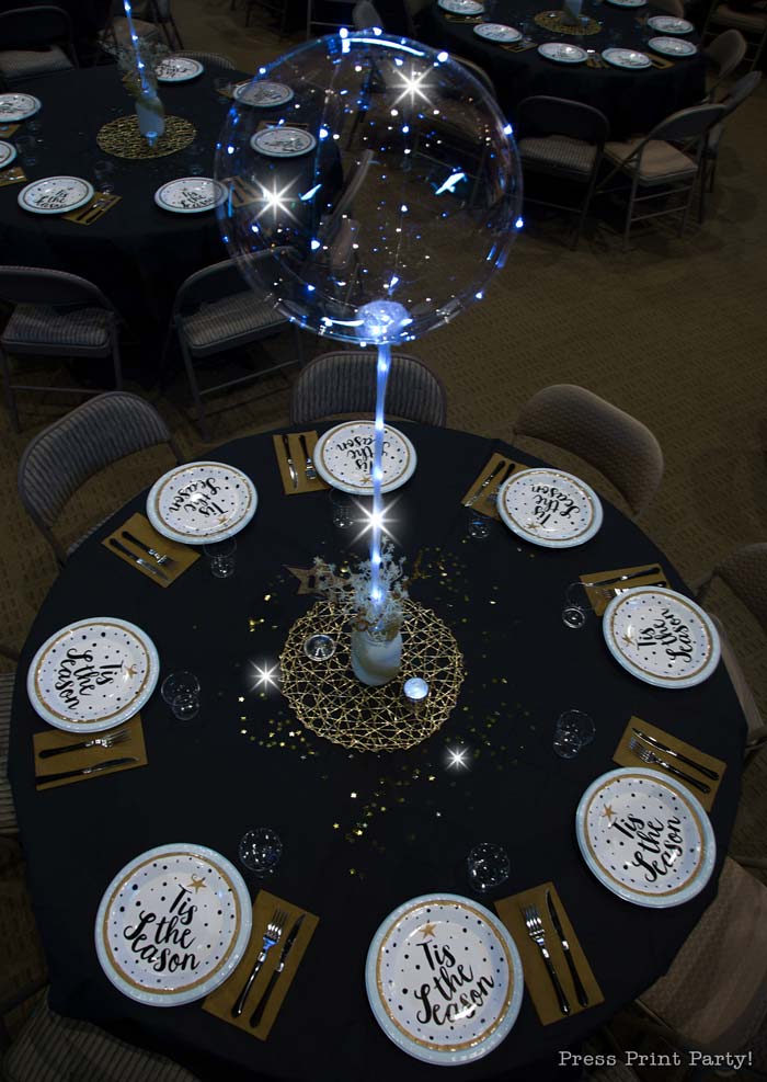 Table at night with shimmering lights.How to set up a sparkling christmas banquet with LED Bobo balloons with string lights. Press Print Party!