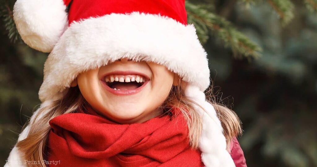 50 actually funny christmas jokes for kids - laughing girl with santa hat - Press Print Party!