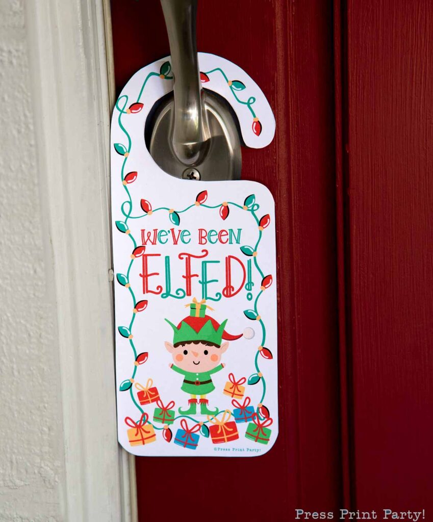 You ve been elfed free printable download. We've been elfed door hanger on red door. Press print Party