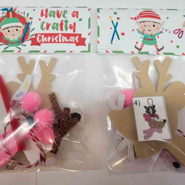 Two craft kits in clear bags, like festive chip bags, contain reindeer decoration materials including cutouts and pom-poms. Each kit features a label with joyous graphics that reads "Kids Valentine Chip Bag Tag Pink, I ❤ Our Friend-chip.