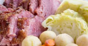 oven roasted corned beef and steamed cabbage on a plate with potatoes and carrots- baking oven cooked -. Press Print Party!