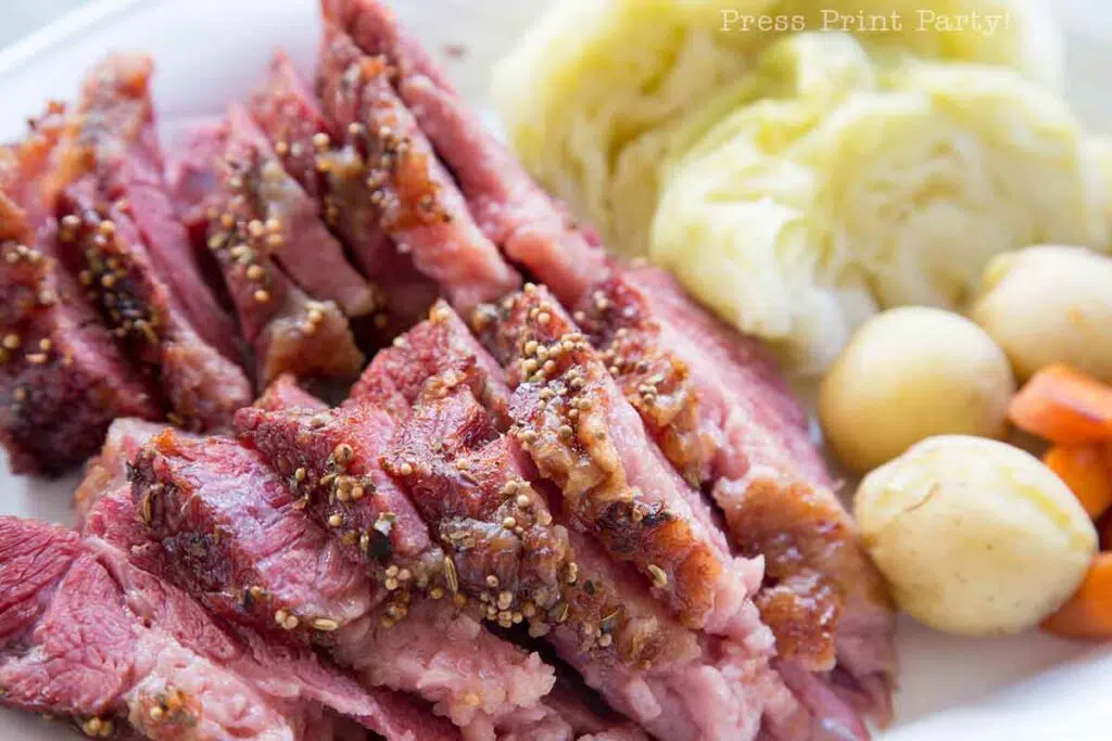 oven roasted corned beef and steamed cabbage on a plate with potatoes and carrots- baking oven cooked -. Press Print Party!