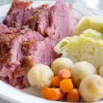 oven roasted corned beef and steamed cabbage on a plate with potatoes and carrots. Press Print Party!
