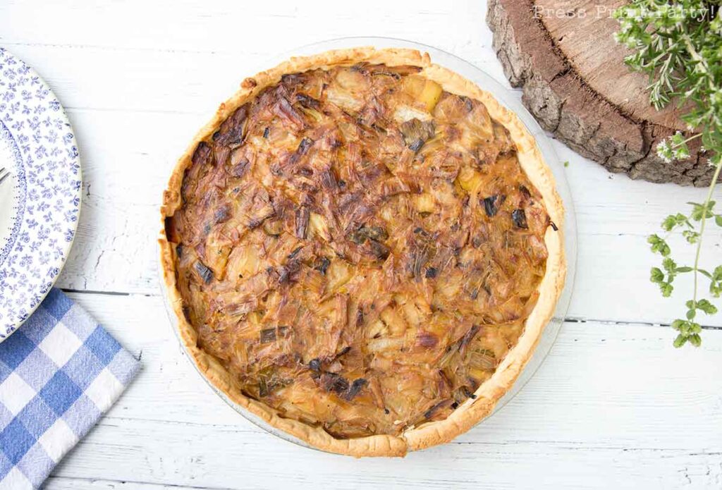 flamiche aux poireaux french leek tart. cooked on white board. Press Print Party!