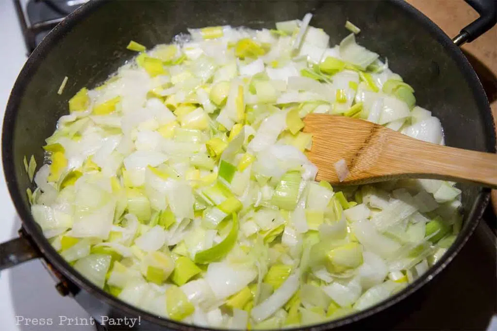 flamiche aux poireaux french leek tart. cut leeks in pan with butter. Press Print Party!