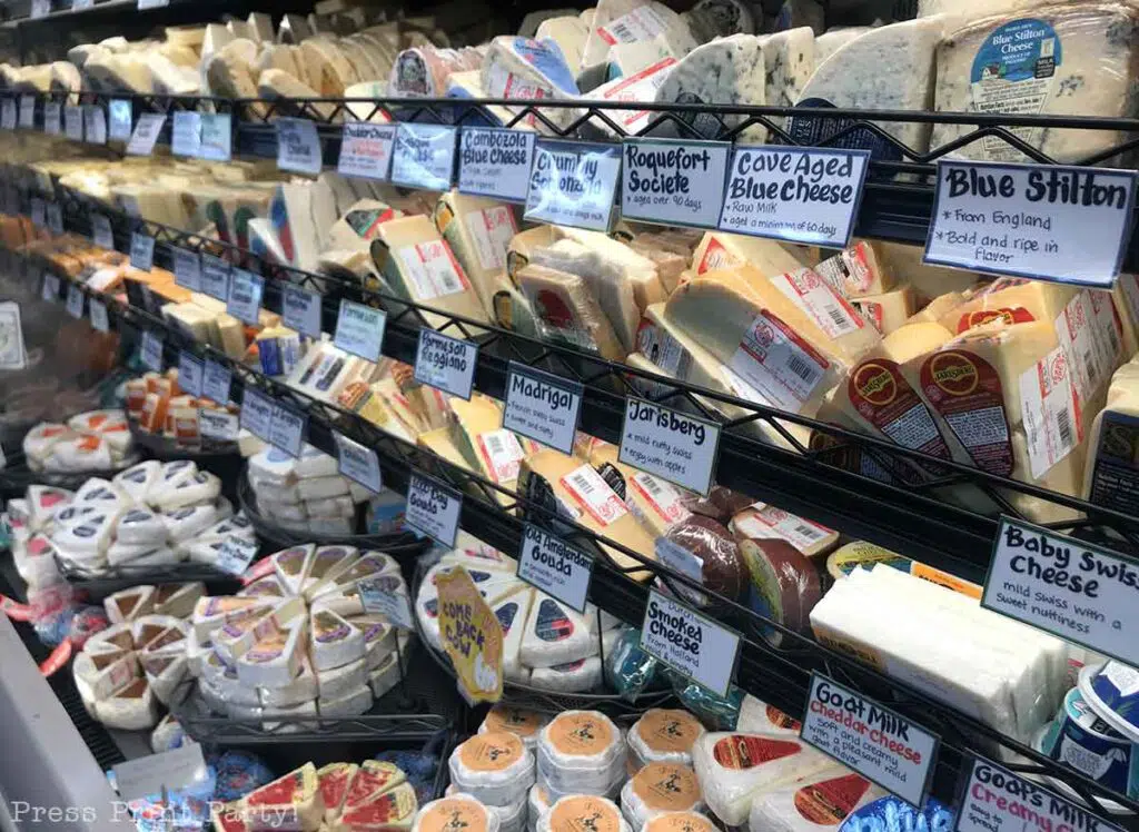 array of cheeses in trader joes for charcuterie board