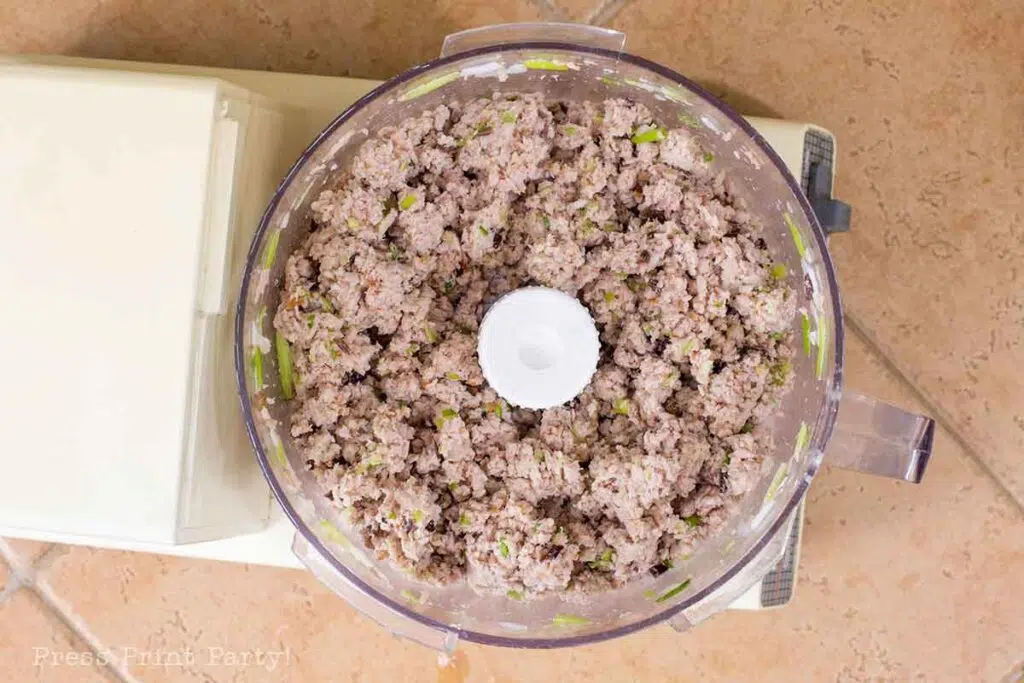 vietnamese egg roll pork and crab and onion mixture in food processor.- How to make vietnamese egg rolls recipe cha gio nem ran - Press Print Party!