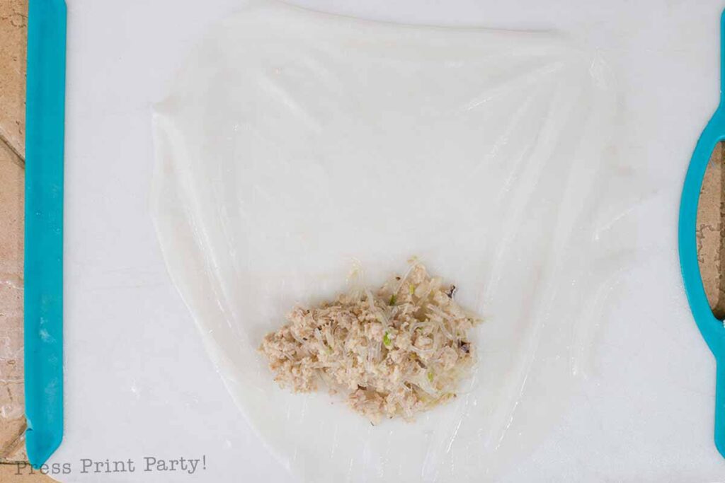 place a small handful of meat mixture on the lower part of the rice paper.- How to make vietnamese egg rolls recipe cha gio nem ran - Press Print Party!