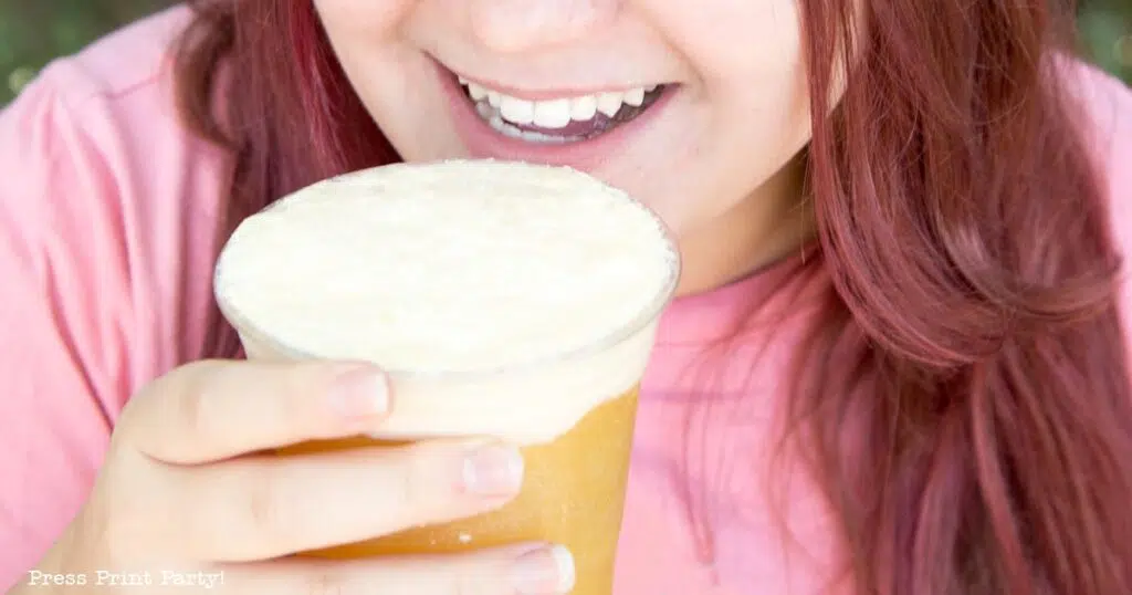 girl drinking tropical punch with ice cream float.10 Easy Punch Recipes for Parties, Non-Alcoholic Summer Drinks - Press Print Party