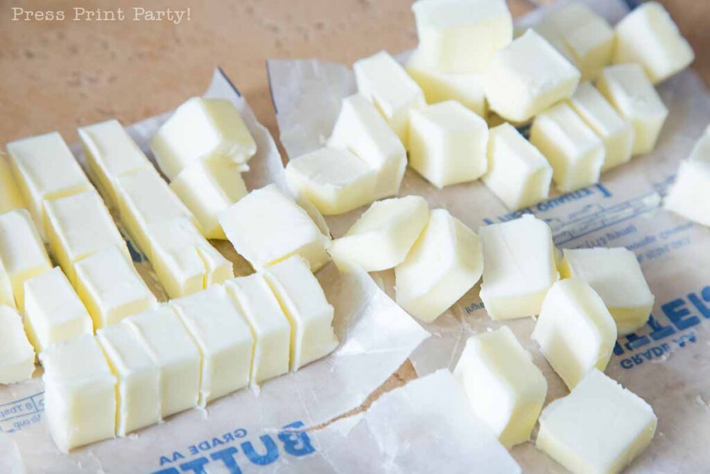 cutting butter in small cubes - easy pie crust homemade recipe with butter - Press Print Party!
