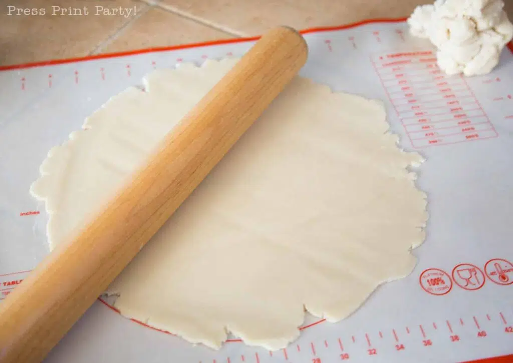 rolling the pie crust on the counter - easy pie crust homemade recipe with butter - Press Print Party!