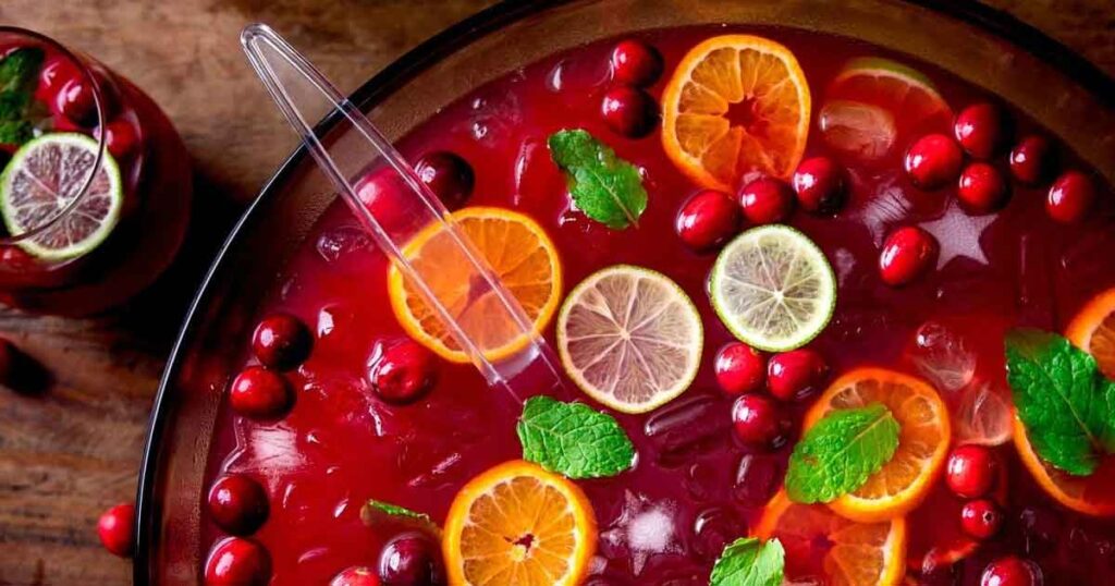 christmas punch with cranberries and oranges - 35 Great Christmas Punch Recipes to Make for a Crowd Press Print Party