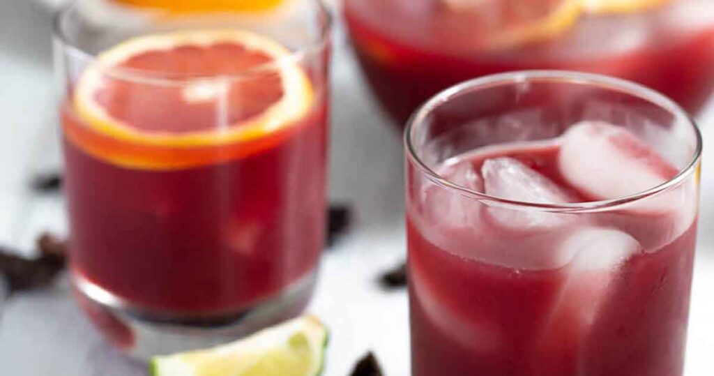 sorrel punch recipe - 35 Great Christmas Punch Recipes to Make for a Crowd - holiday party punch - Press Print Party