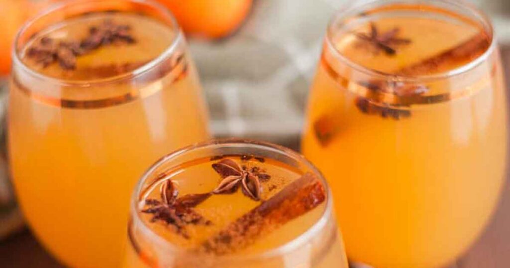 boozy apple cider - 35 Great Christmas Punch Recipes to Make for a Crowd - holiday party punch - Press Print Party