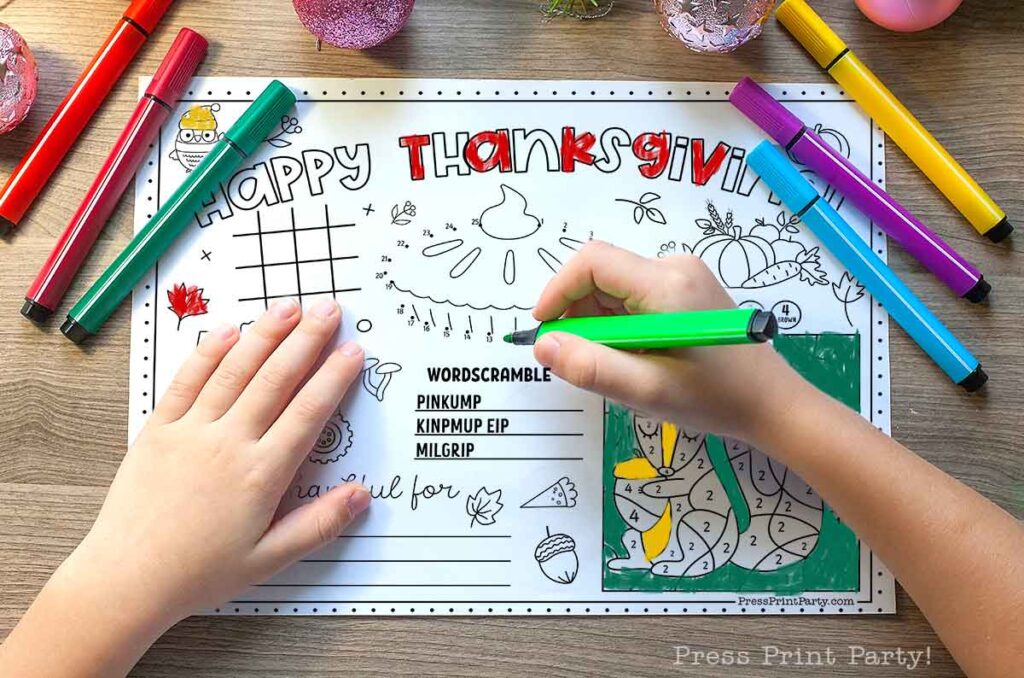 3 Thanksgiving Coloring Placemats Free Printable for kids activity letter size 85x11 with kids hands coloring in colored pens Press Print Party