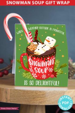 snowman soup printable kit wrap, snowman soup gift bag topper, snowman soup recipe with chocolate mix, candy cane and kisses. When the weather outside is frightful, snowman soup is so delightful. Press Print Party.