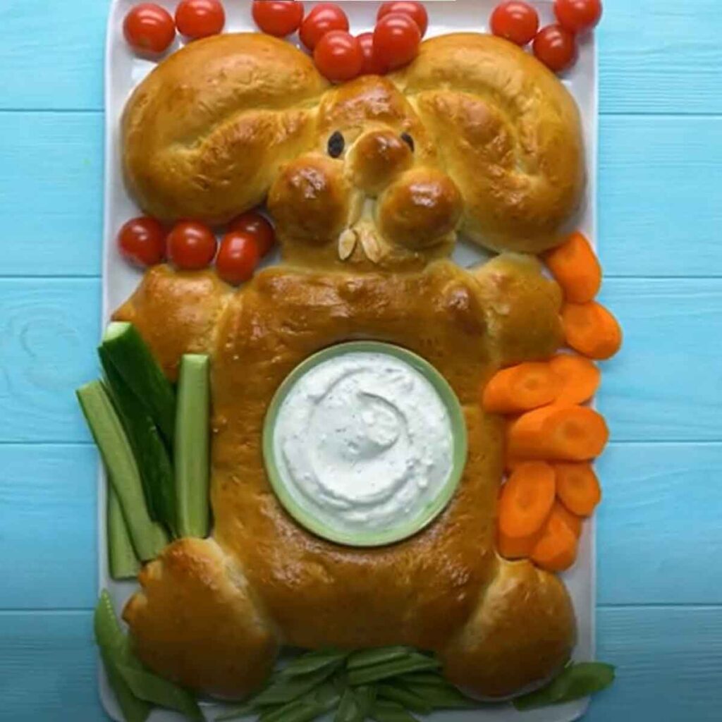 bunny bread with dip in middle- Beautiful Easter Charcuterie Board Ideas - Press Print Party