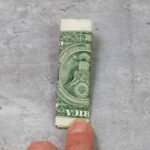 folded dollar bill 3 times to make a money lei - Press print Party