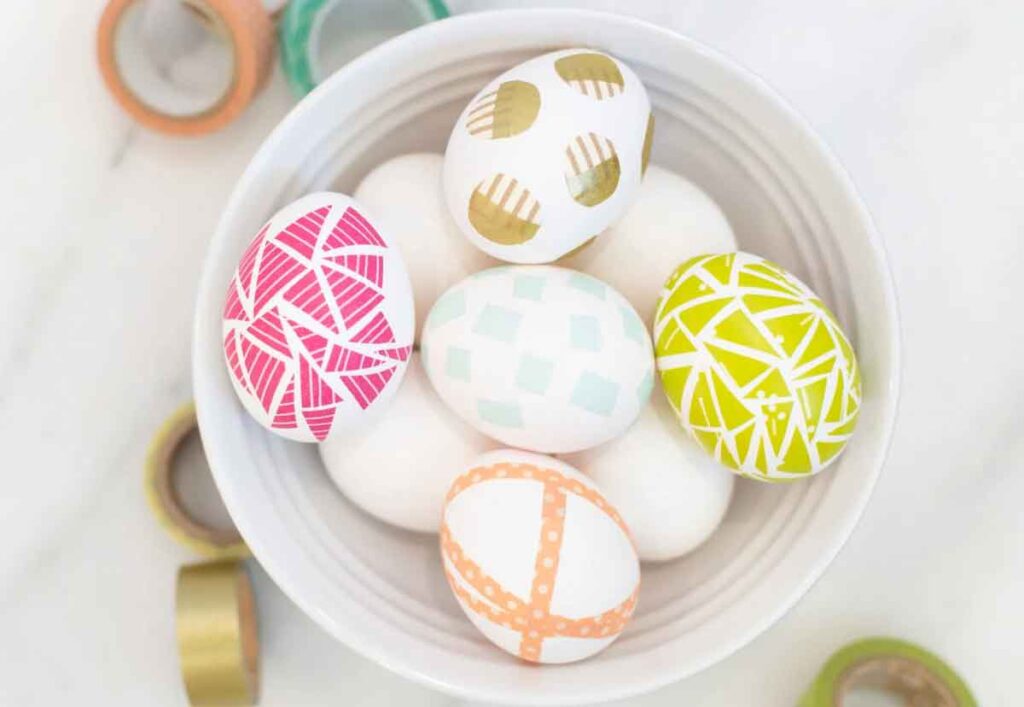 using wahi tape on Easter eggs - 13 Creative Ideas for Coloring Easter Eggs with the Kids- Press Print Party!