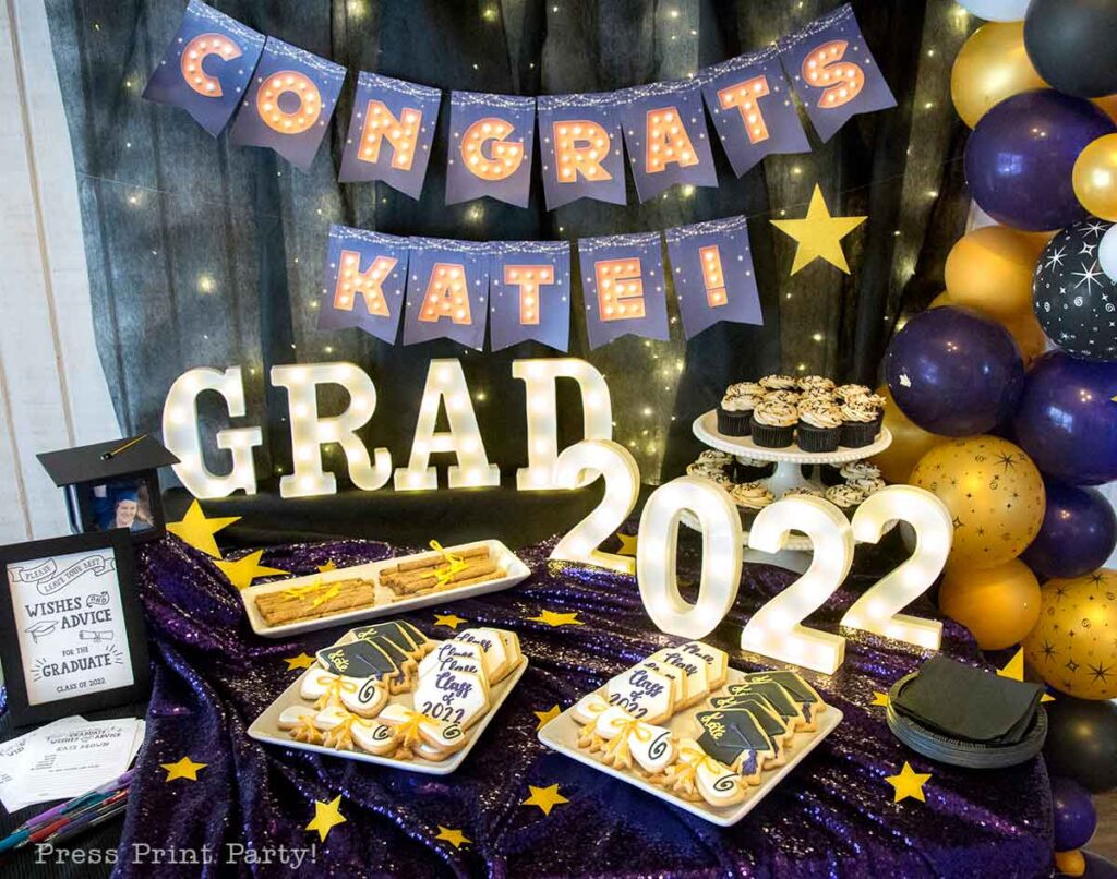graduation party dessert table decoration ideas. grad party lit up marquee sign and butter graduation cookies. Press Print Party