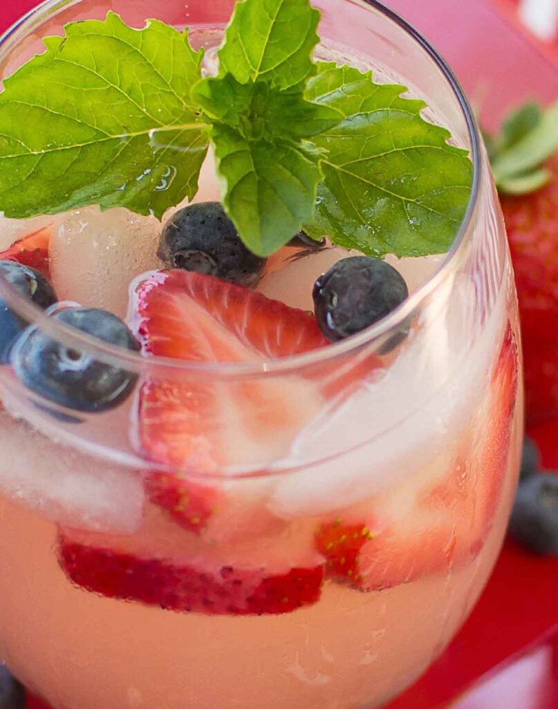 berry moscato sangria- 75 Red White and Blue Food Ideas and Patriotic Recipes for fourth of July, memorial day. Press Print Party!