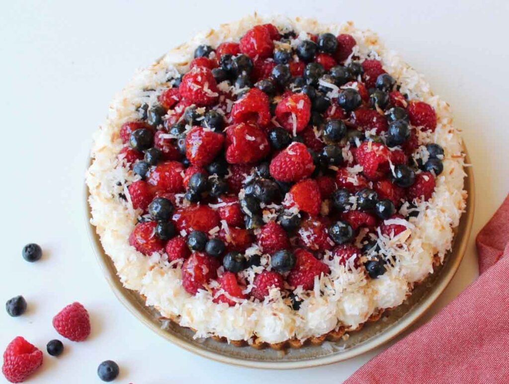 coconut tart with berries - 75 Red White and Blue Food Ideas and Patriotic Recipes for fourth of July, memorial day. Press Print Party!