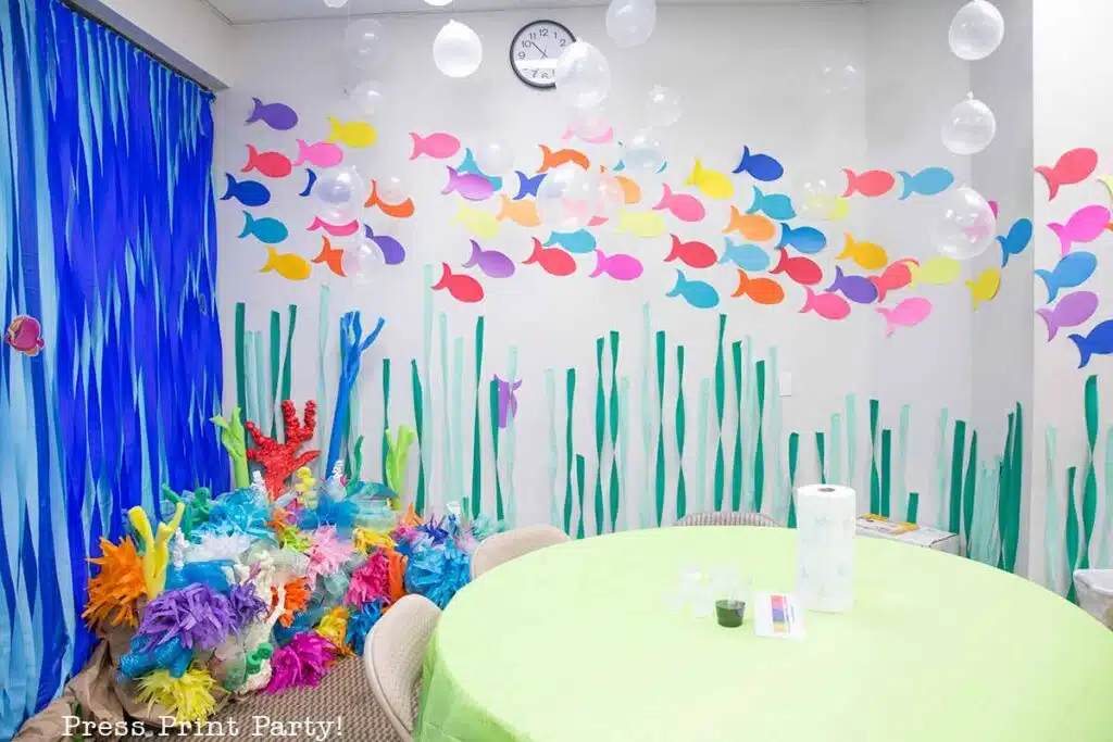 free printable simple fish template outline cutout on wall with streamer sea weed for under the sea vbs or party - Press Print Party.