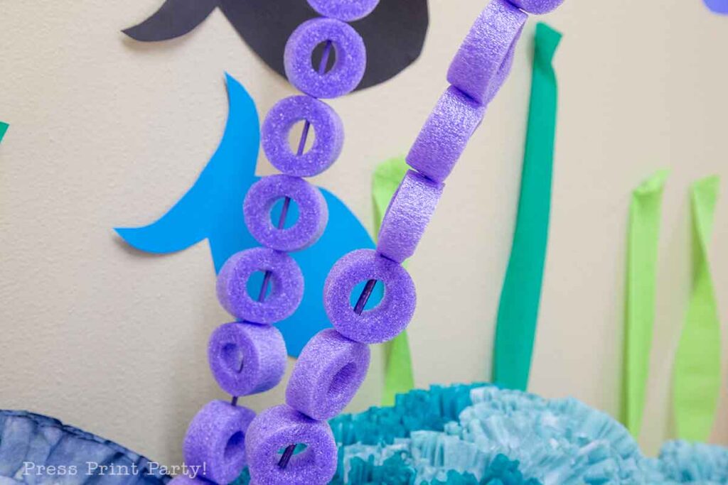 coral with pool noodles cut in circle in purple