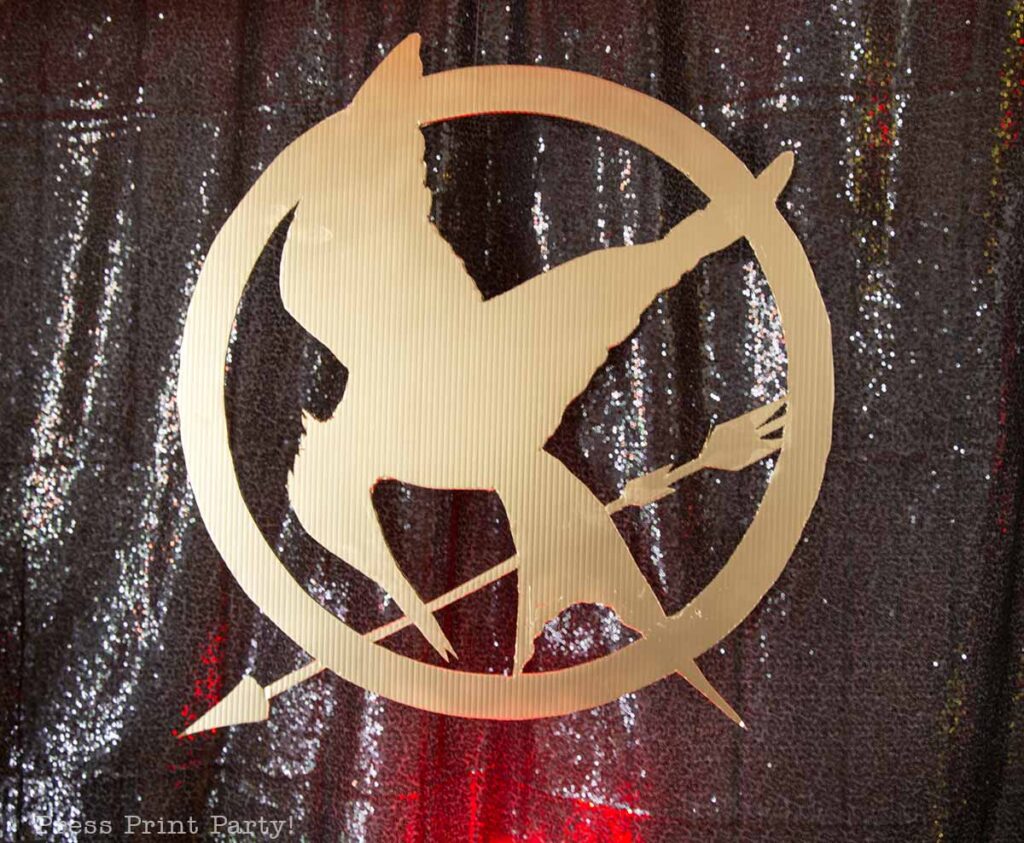 mockingjay pin sign- Our epic hunger games party for teens, hunger games party theme birthday party, food, decorations and games - Press Print Party