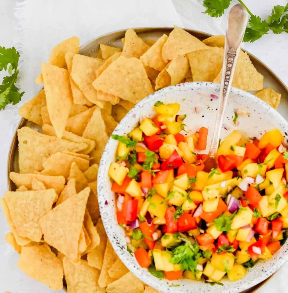 Mango salsa- 25 Yummy Hawaiian luau party foods for your next backyard bash - tropical foods and recipes - Press Print Party!