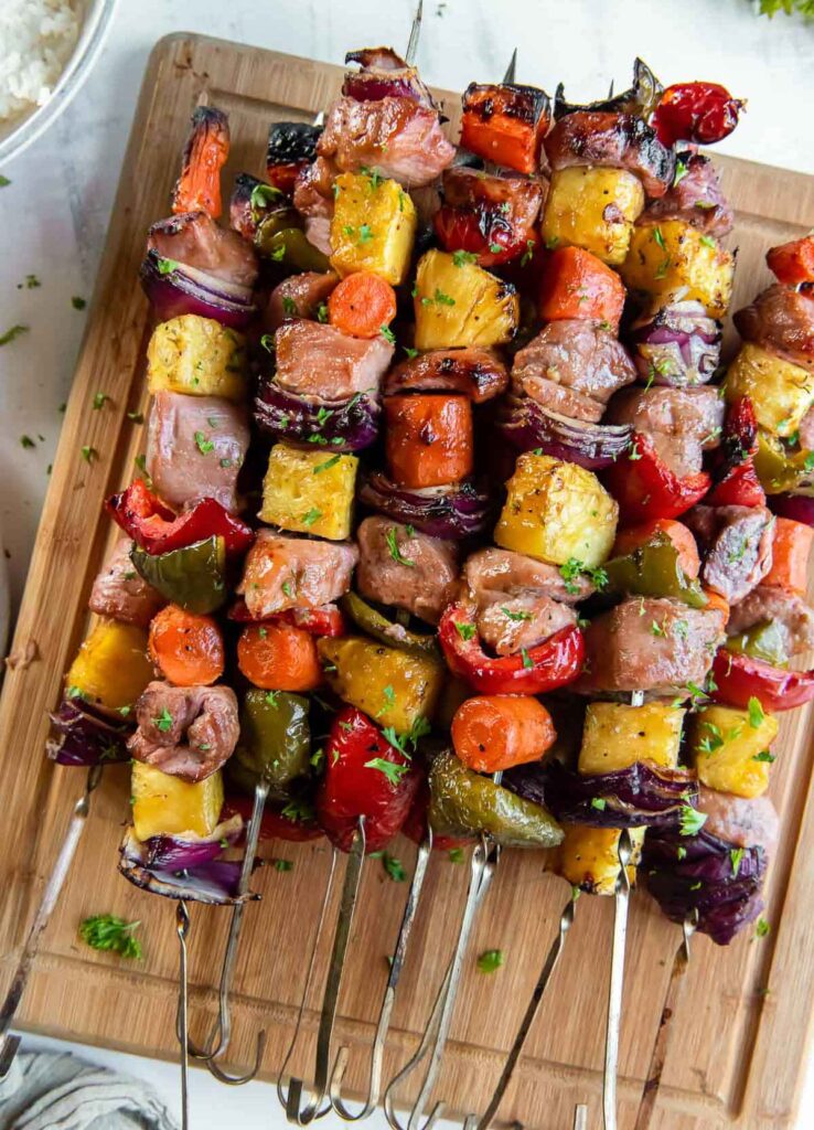 sweet sour pork kabobs - 25 Yummy Hawaiian luau party foods for your next backyard bash - tropical foods and recipes - Press Print Party!
