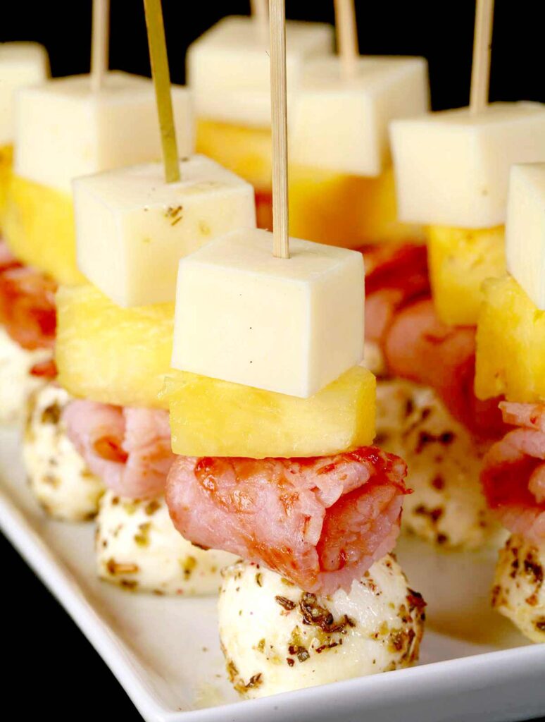 hawaiian pizza skewers - 25 Yummy Hawaiian luau party foods for your next backyard bash - tropical foods and recipes - Press Print Party!