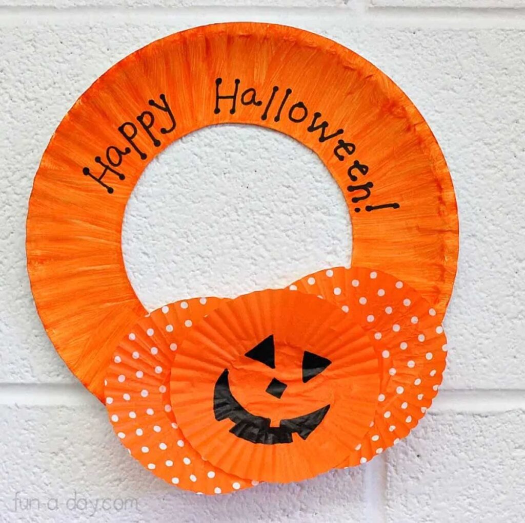 pumpkin paper wreath - 19 Festive and easy Halloween crafts for kids - Press Print Party!