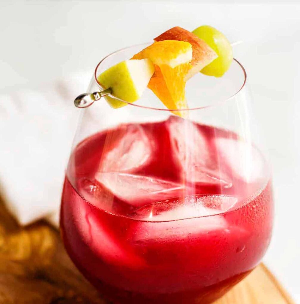 non-alcoholic sangria served with fruit- Tasty Thanksgiving punch recipe non-alcoholic and alcoholic to feed a crowd. Press Print Party