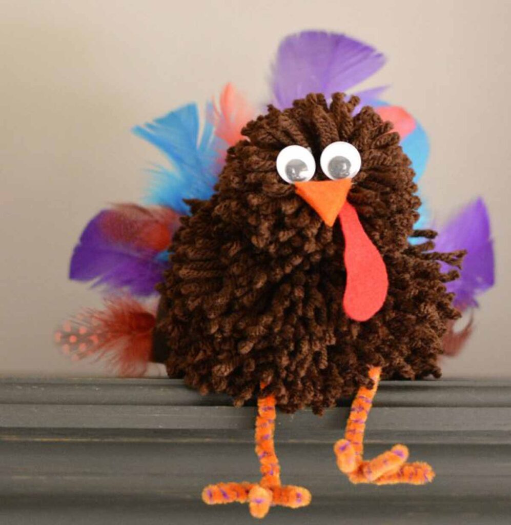 turkey pom pom craft- 45 Turkey crafts ideas for kids - Press Print Party!